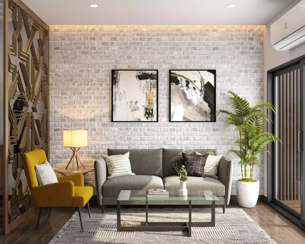 Abstract framed art on whitewashed brick accent wall in living room