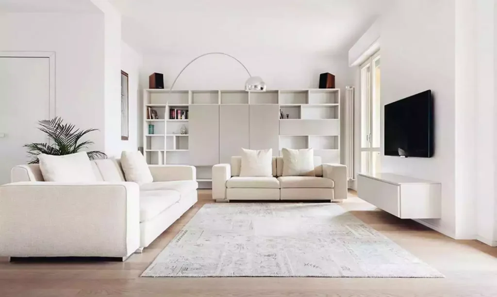 All-white modern living room, arc lamp, grid wall unit, floating console