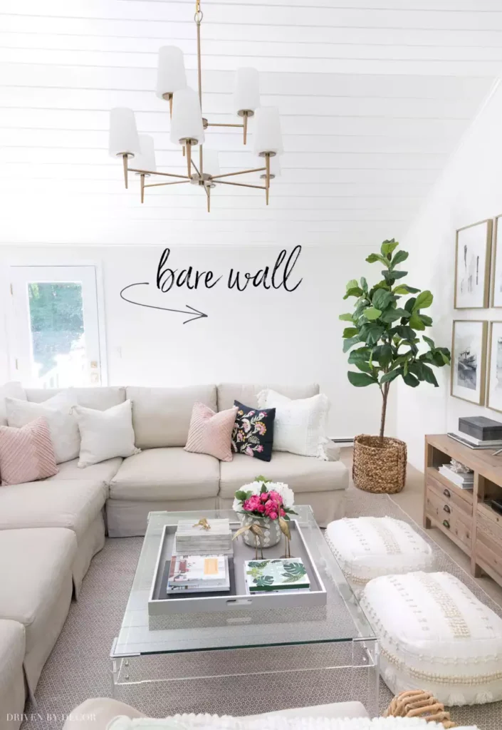 Bare living room wall labeled "bare wall," before adding wall decor