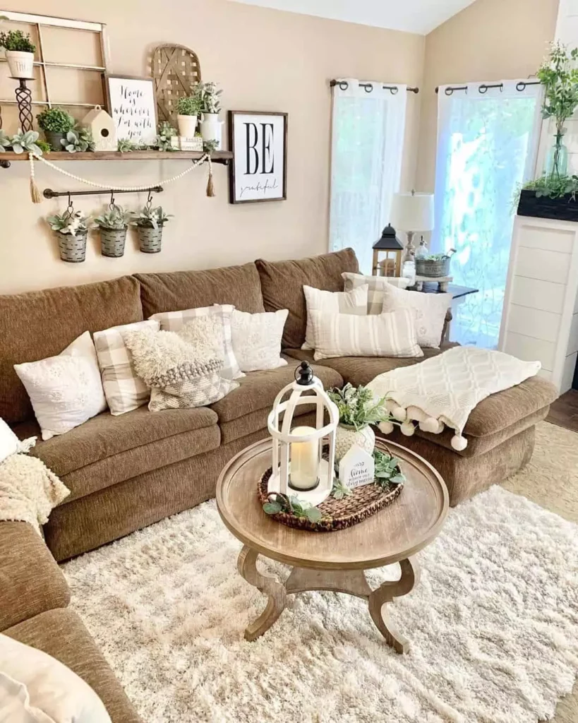 Beige farmhouse wall with hanging planters across the above sofa wall