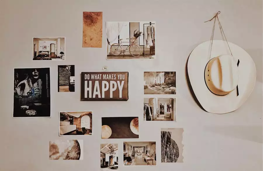 Black And White Print Collage With A Happy Sign And Cowboy Hat As Dorm Wall Decor