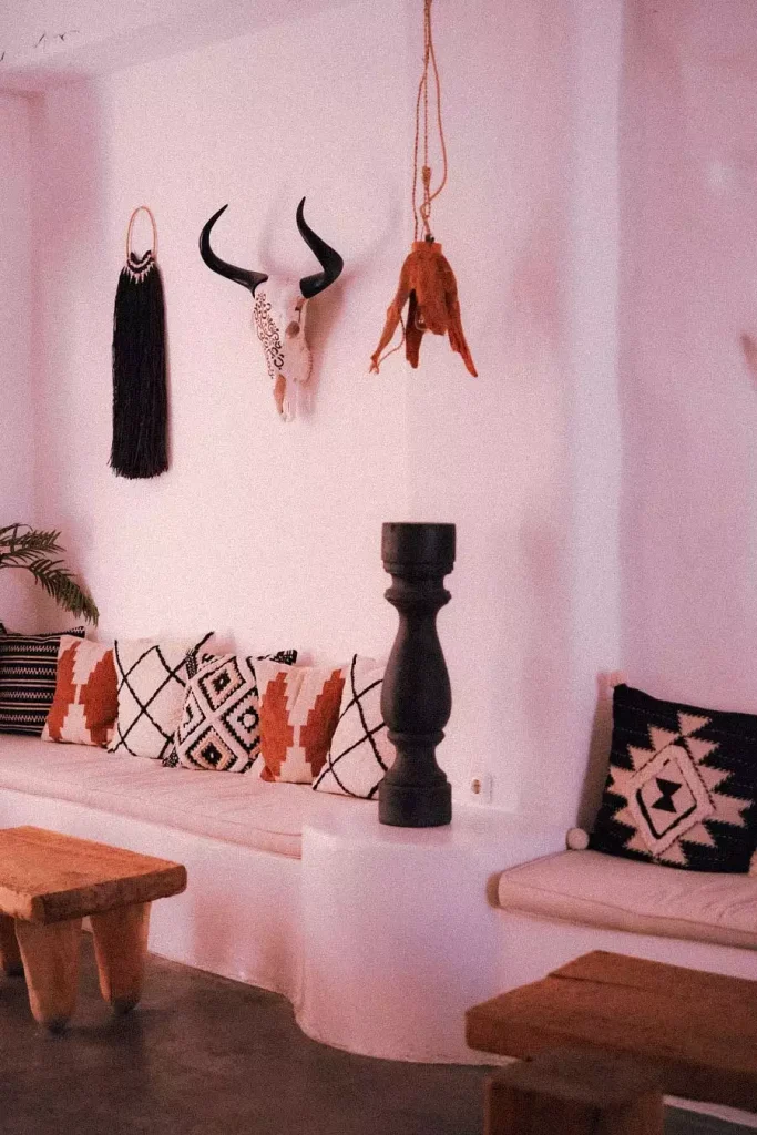 Boho Pink Wall Decor Nook With A Skull And Patterned Cushions