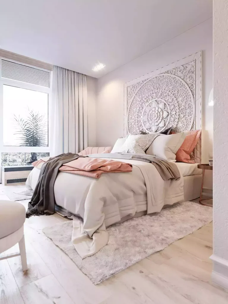 Carved white wall headboard bedroom, blush throws, fluffy rug, tall window