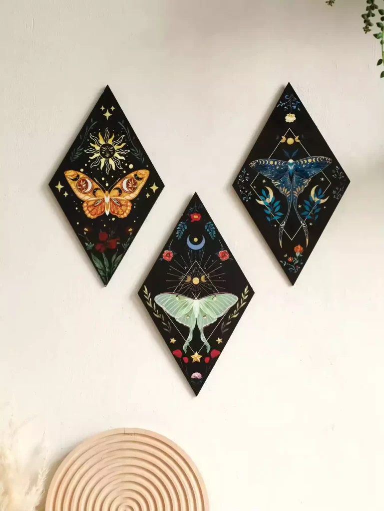 Celestial moth and Butterfly Wall triptych in diamond-shaped black panels