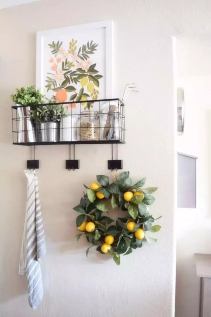 Citrus print, wire basket shelf, and lemon wreath on a kitchen wall