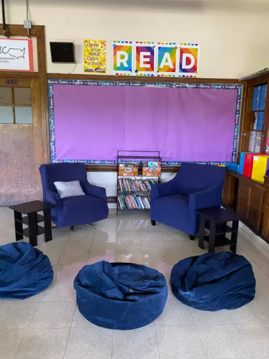 Classroom Reading Nook Idea With Rainbow Read Wall Decor And Blue Armchairs