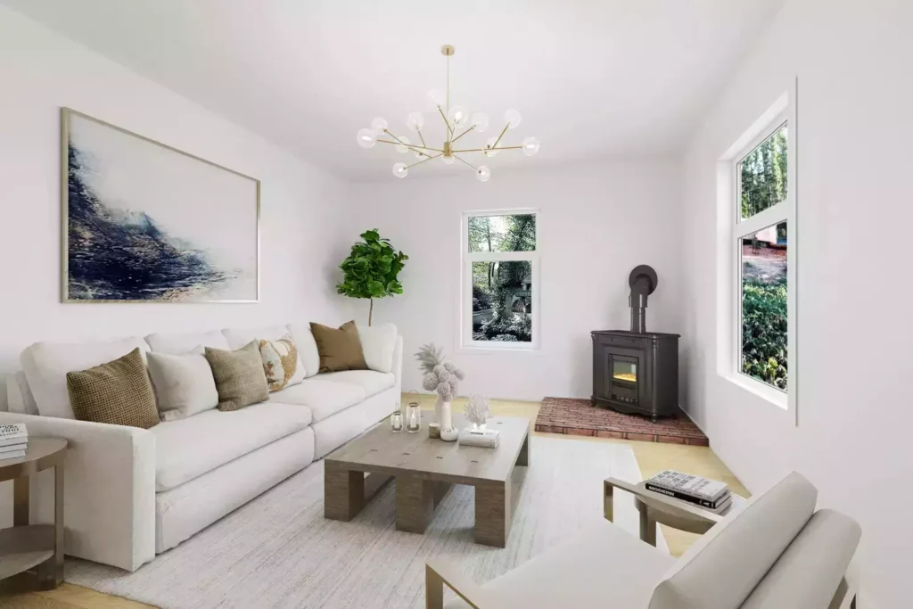 Crisp white living room, sputnik chandelier, wood stove, abstract landscape art