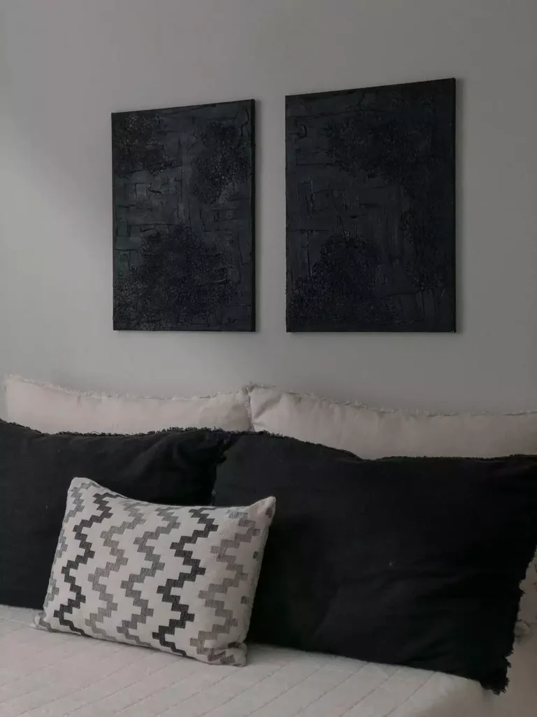 Dark textured diptych canvases as moody over the bed wall decor