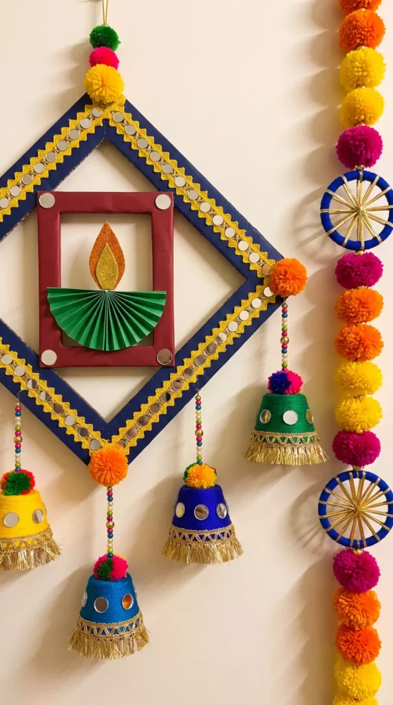 Diamond mirror-work frame with diya and bell tassels for festive Diwali wall decor