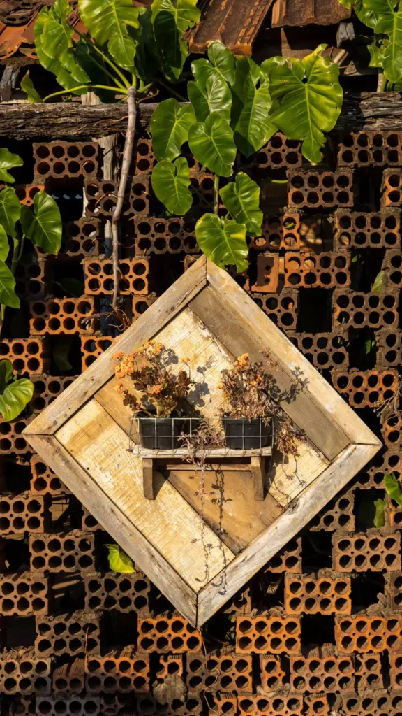 Diamond Shaped Plant Shelf Mounted On A Hollow Brick Wall