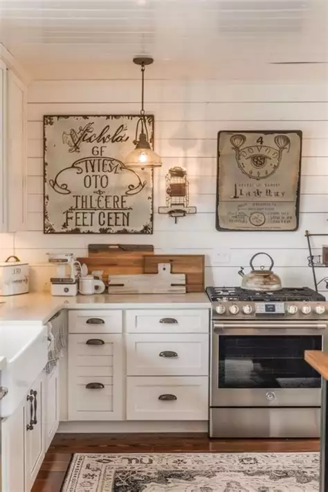 Distressed metal signs on white shiplap kitchen wall