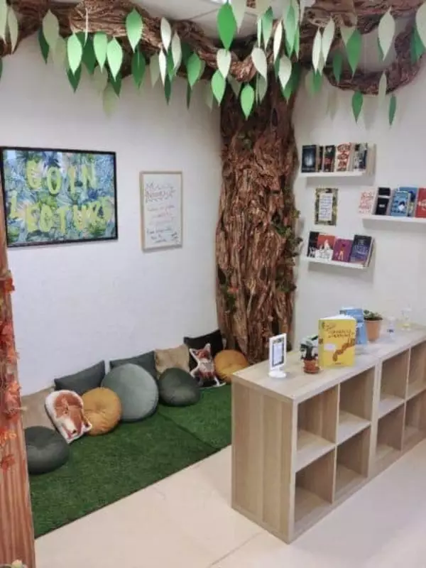 Diy Reading Corner Idea With A Hanging Leaf Canopy And Tree Trunk Accent Wall