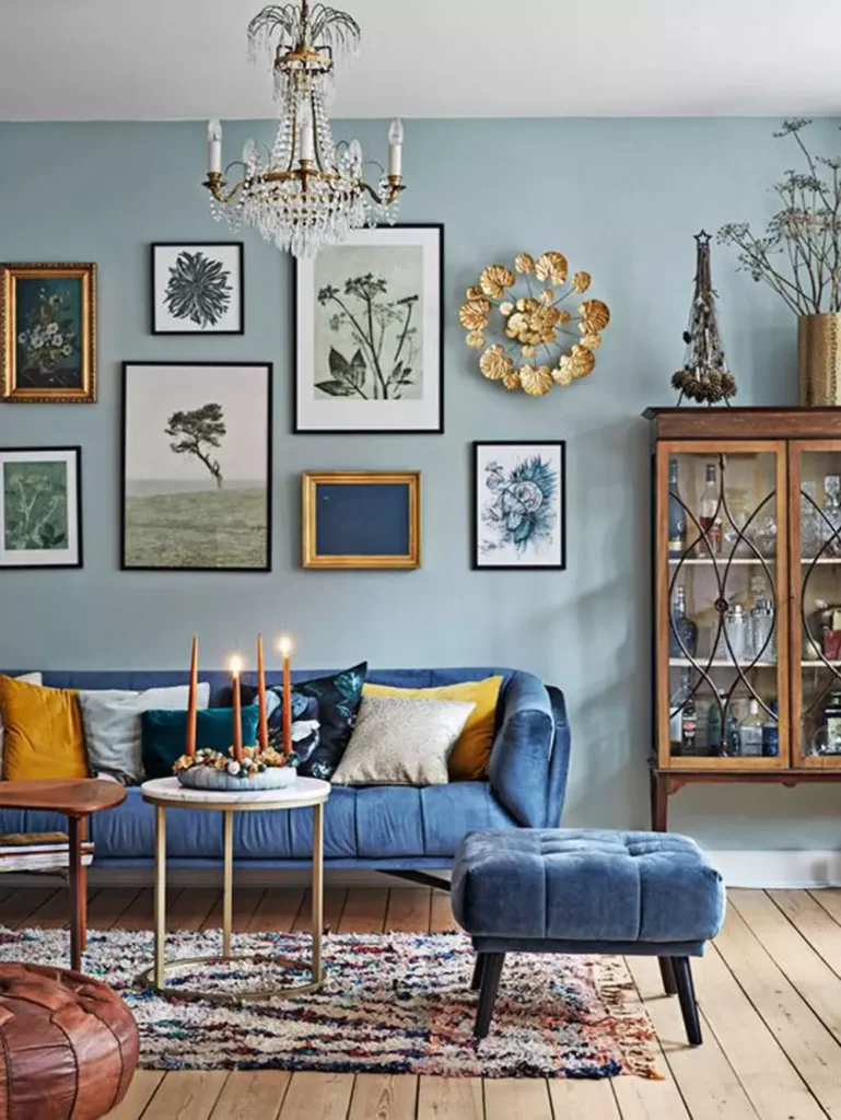 Eclectic Living Room With Light Blue Walls And A Bold Blue Velvet Sofa