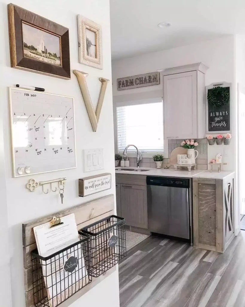 Farmhouse kitchen wall with a calendar, letter V, and wire mail baskets