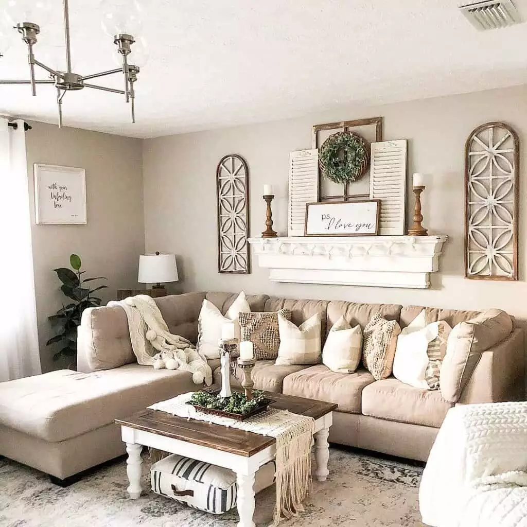 Farmhouse mantel wall decor with wreath and arched wood accents over sofa