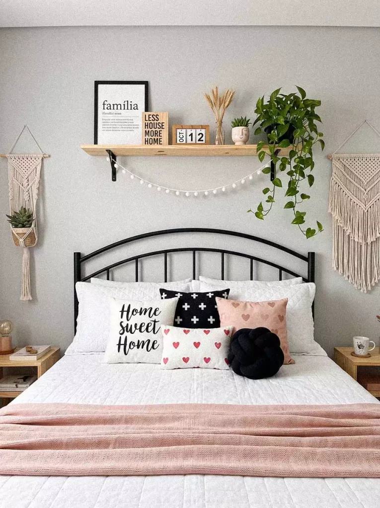 Floating Shelf Decor With Plants And Macrame Above A Black Headboard