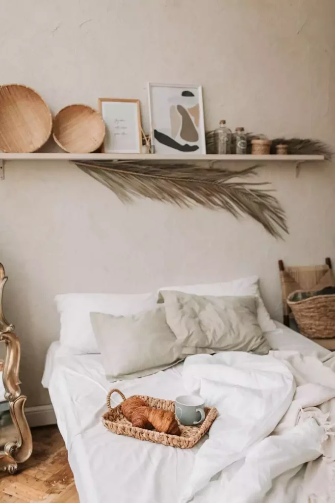 Floating Shelf Wall Decor With Woven Trays And A Dried Palm Leaf For A Small Bedroom