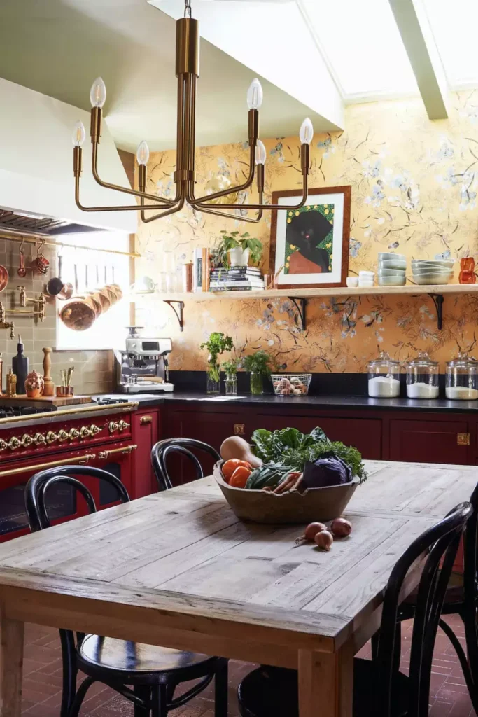 Floral wallpaper kitchen wall with a framed portrait above open shelves