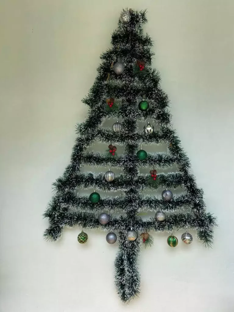 Frosted Tinsel Christmas Wall Tree Decorated With Silver, Gold, And Green Ball Ornaments