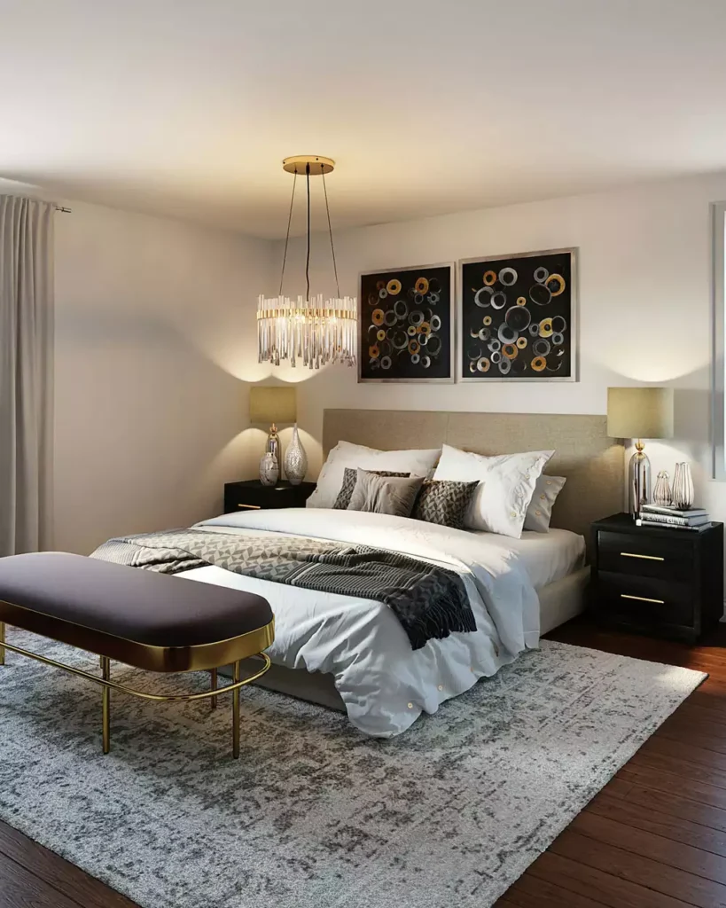 Glam bedroom decor with crystal chandelier, black nightstands and gold upholstered bench