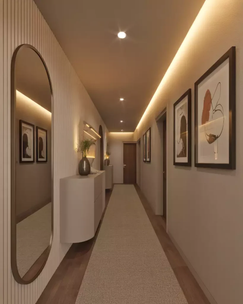 Hallway wall glowing with hidden cove lighting and framed abstract art