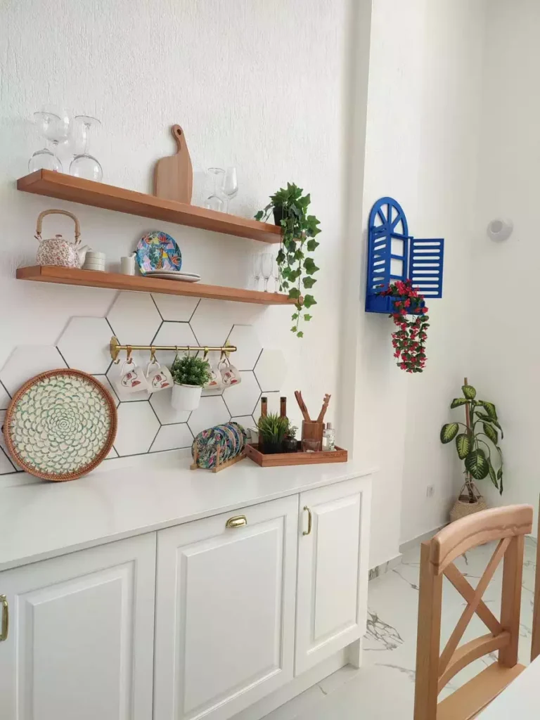 Hexagon Tile Backsplash With Floating Shelves And A Blue Window Shutter For Colorful Kitchen Wall Decor