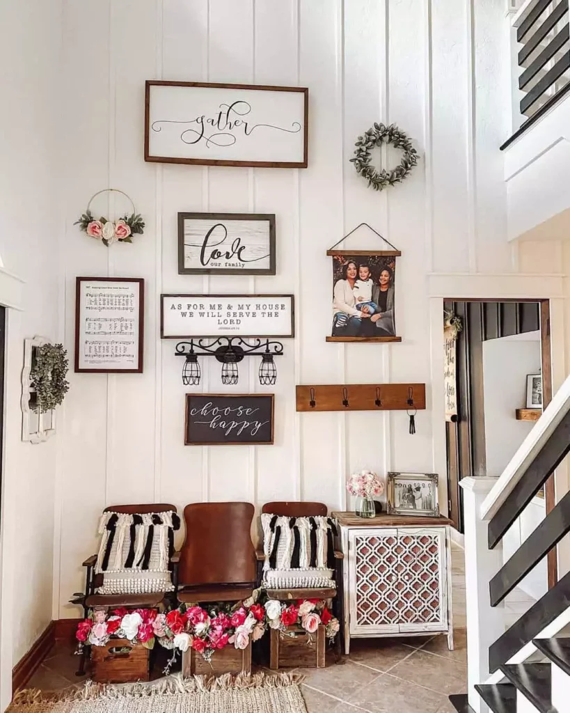 Layered wood sign gallery wall with wreaths and a hanging family photo