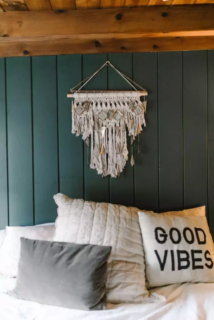 Macrame Hanging On A Deep Green Paneled Wall Is Simple Dorm Wall Decor Above A Good Vibes Pillow