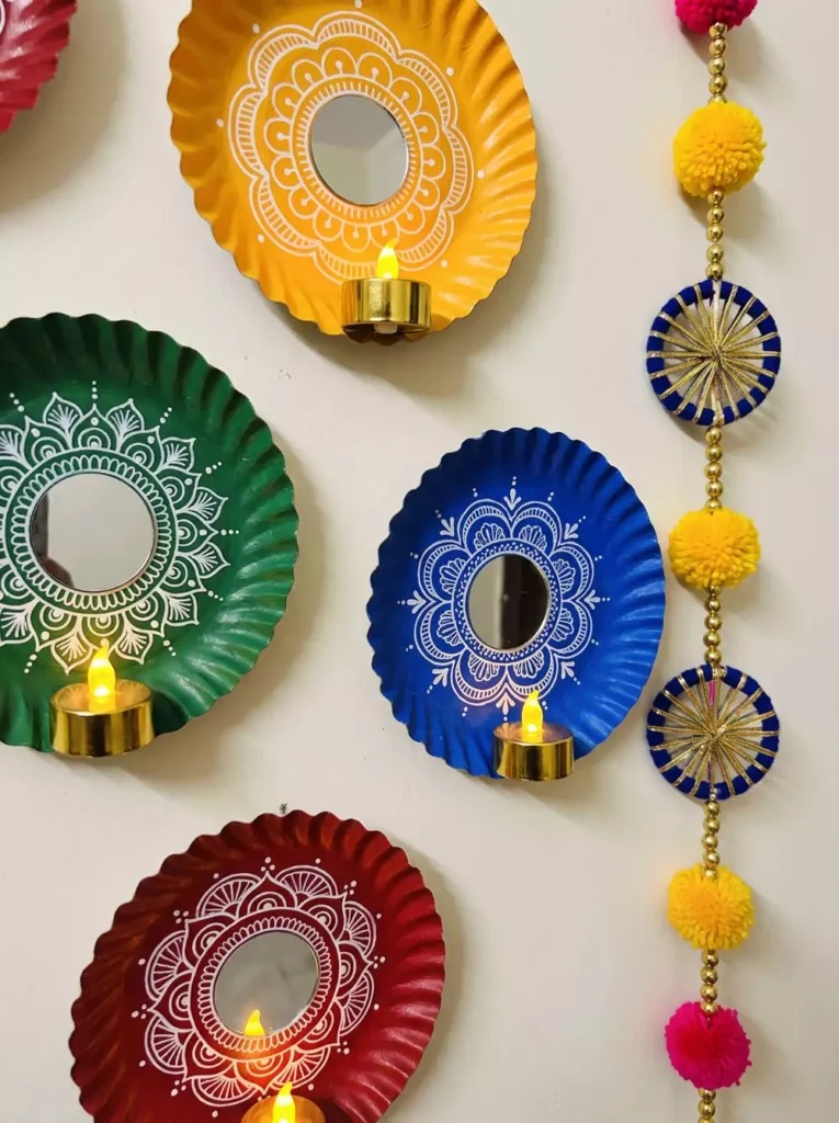 Mirror mandala plates in yellow, green, blue, and maroon, styled as candlelit Diwali wall decor