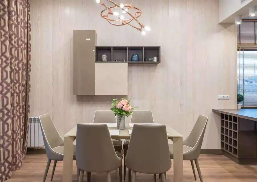 Modern Dining Wall Decor With A Two Tone Wall Cabinet And Open Shelf On A Pale Wood Panel Wall Above A Beige Dining