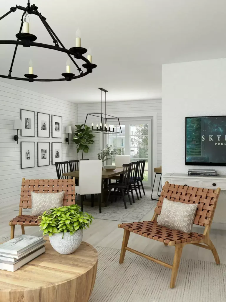 Modern farmhouse room decor with woven leather sling chairs, white shiplap walls and black wagon wheel chandeliers