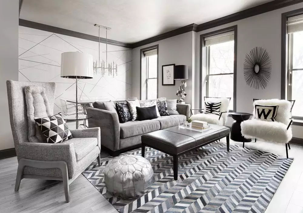 Monochrome grey living room decor idea with dark trim, herringbone rug and faux fur accent chair