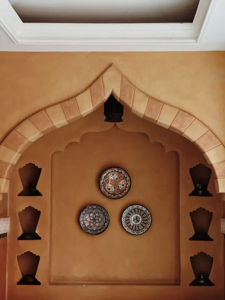 Moroccan Style Wall Arch Niche With Candle Lanterns And Painted Plates