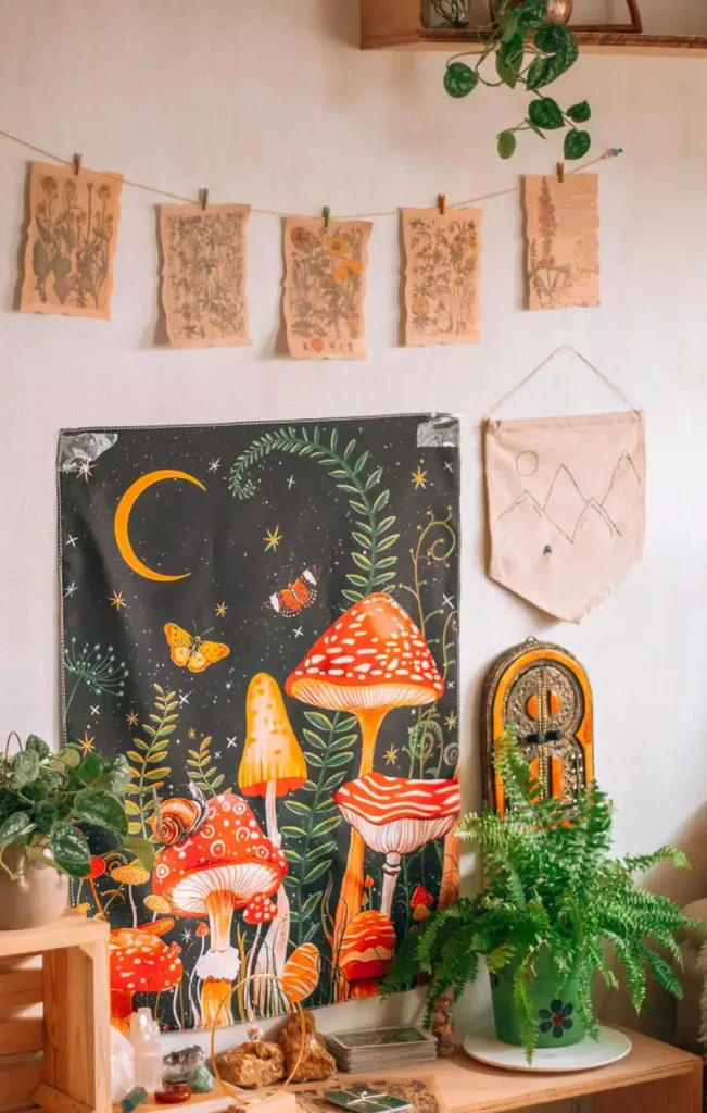 Mushroom Tapestry And Pressed Botanical Prints Add Whimsical Dorm Wall Decor Beside A Leafy Fern