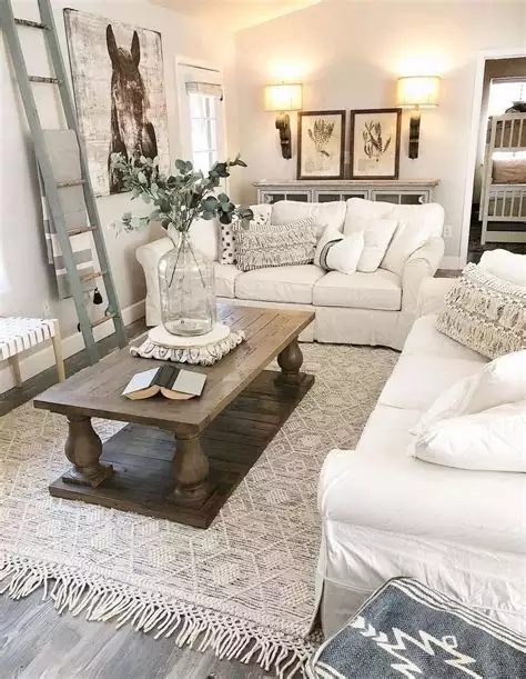 Neutral farmhouse living room with framed animal print and eucalyptus decor