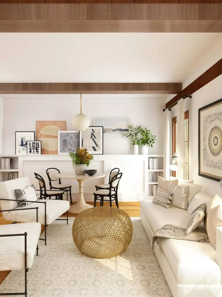 Open Concept Tan Wall Living Room With A Gallery Art Ledge And A Round Dining Table