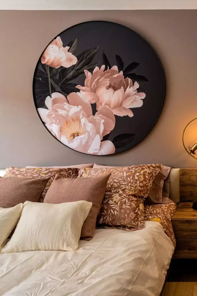 Oversized Round Floral Wall Decor Above A Neutral Bed