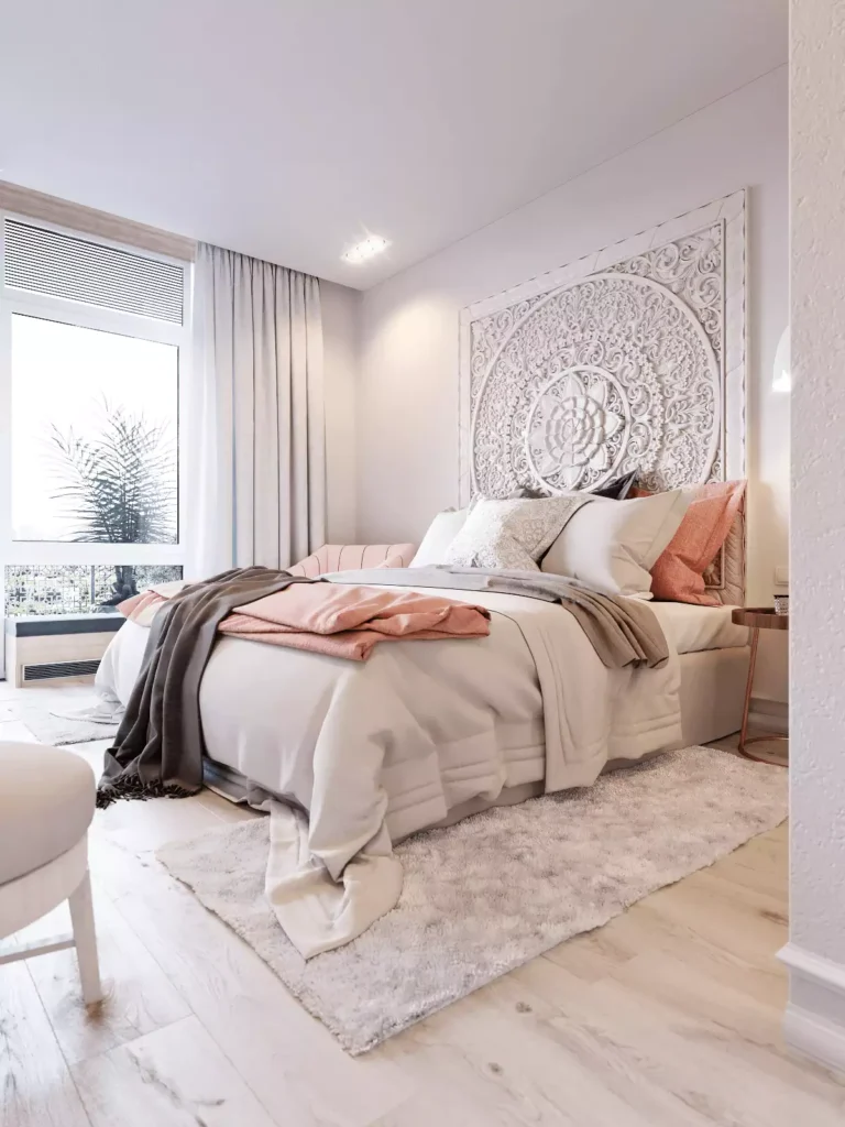 Oversized carved wood mandala panel used as a bedroom headboard wall accent