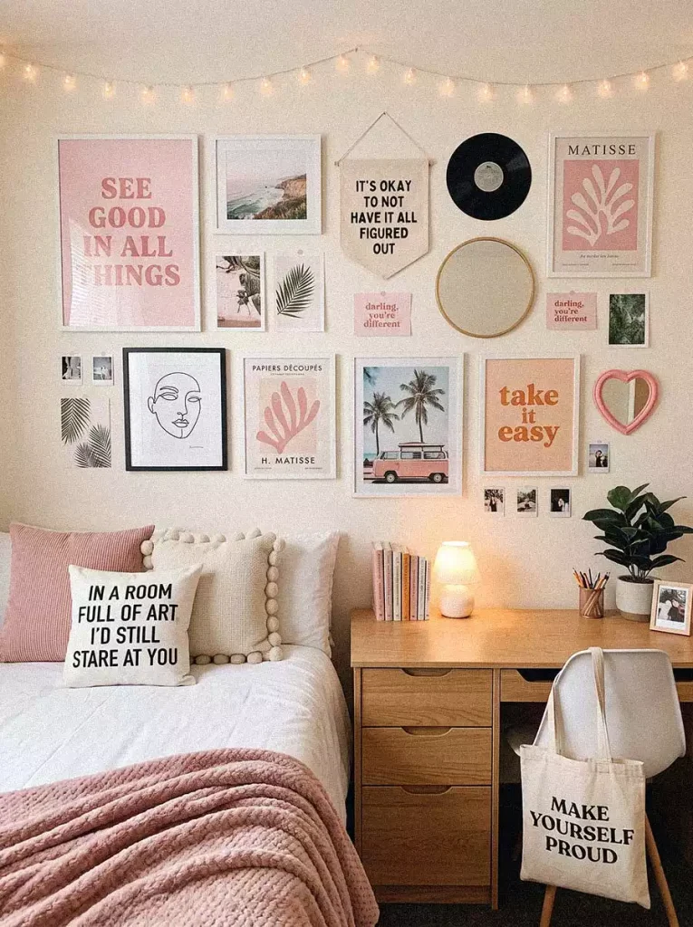 Pink Dorm Wall Decor Gallery Wall With Framed Prints Quote Posters And String Lights Above A Desk