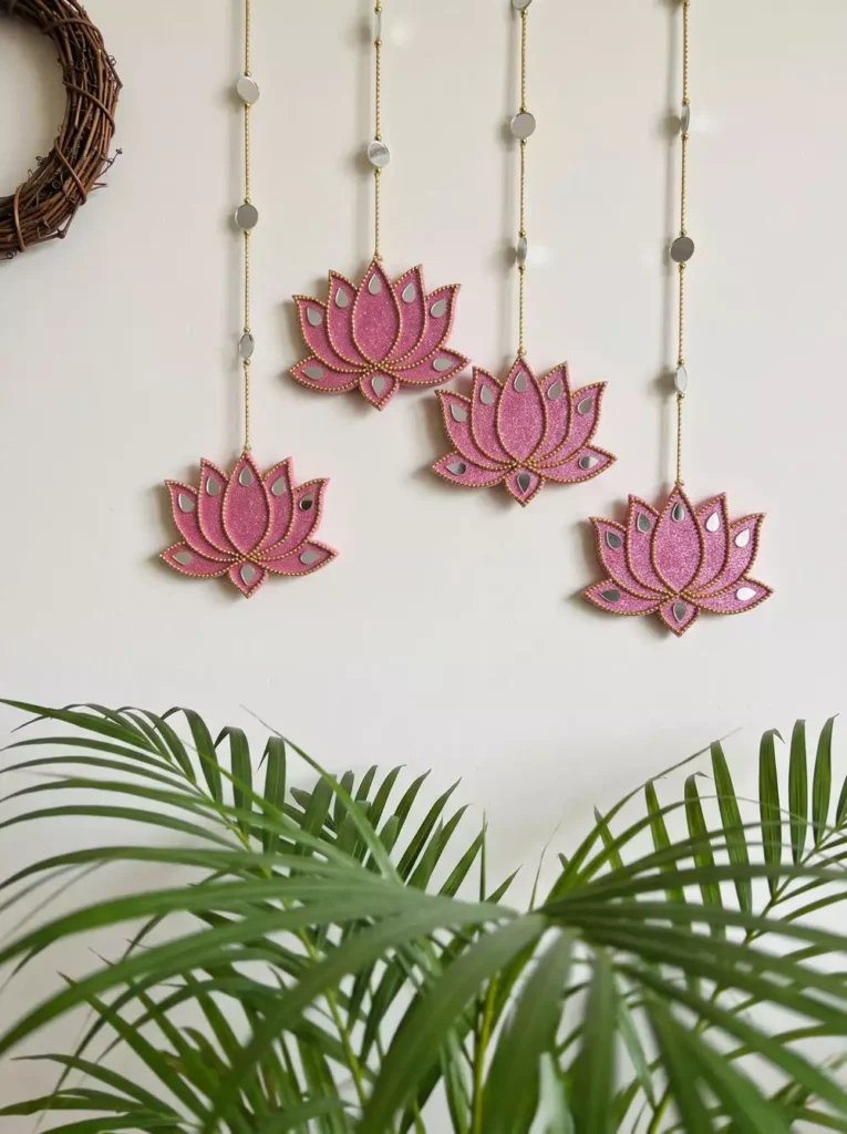 Pink glitter mirrored lotus ornaments as soft, feminine Diwali wall decor