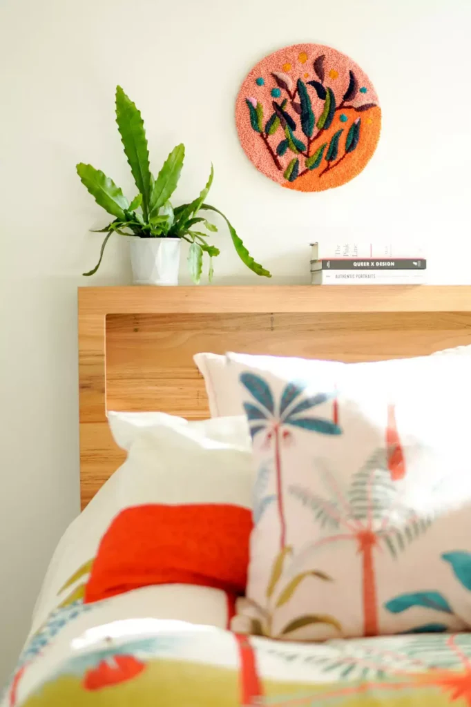Punch needle floral textile art as playful over the bed wall decor