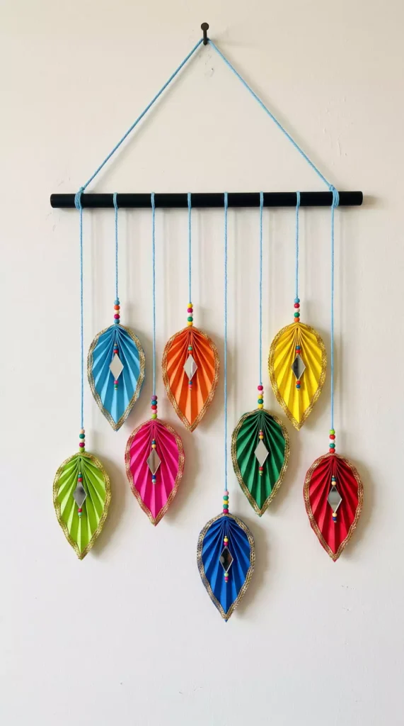 Rainbow of pleated paper leaves with mirror accents, eye-catching Diwali wall decor