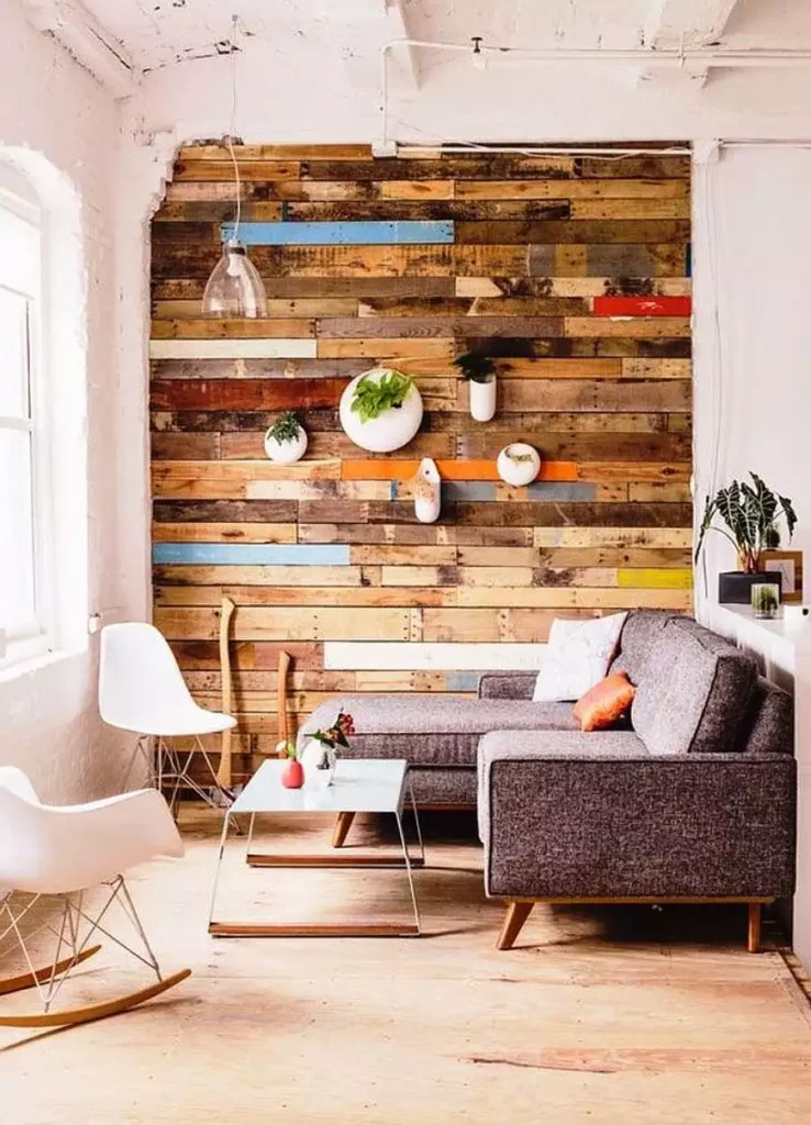 Reclaimed wood accent wall with hanging planters in small living room