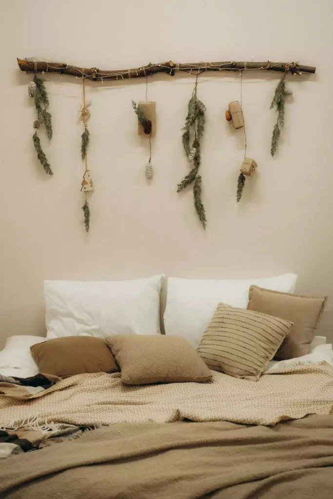 Rustic branch garland with pinecones as festive over the bed wall decor