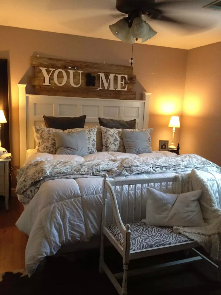 Rustic wood YOU and ME sign as farmhouse style over the bed wall decor