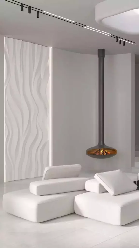 Sculpted white relief wall, hanging fireplace, modular loungers, track lights