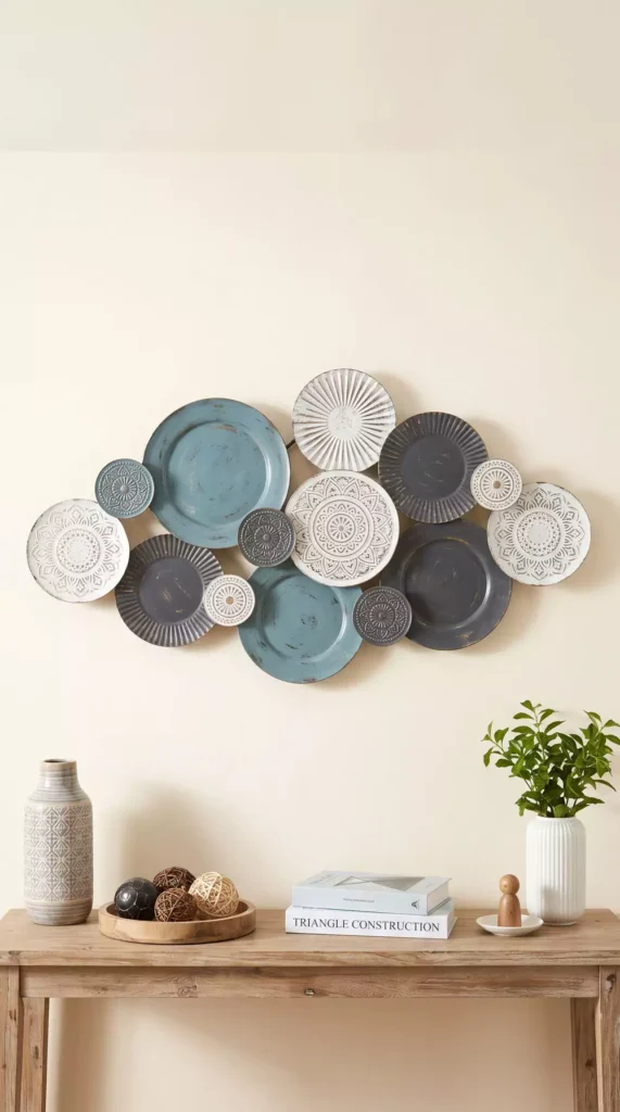Textured teal and white plate wall decor in an oval cluster above a wooden console