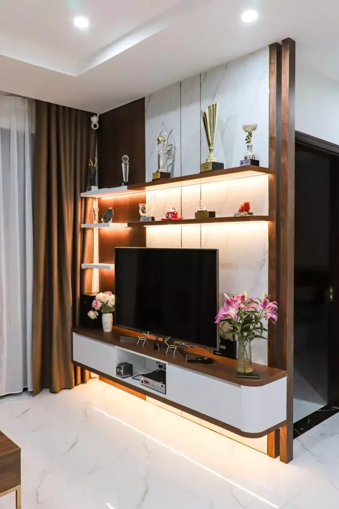 Trophy Display TV Wall With Marble Panels And Warm Under Shelf Lighting