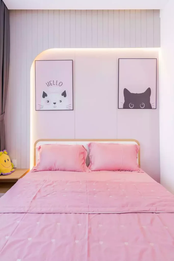 Two Cat Prints And A Glowing Arched Panel As Small Bedroom Wall Decor Above A Pink Bed