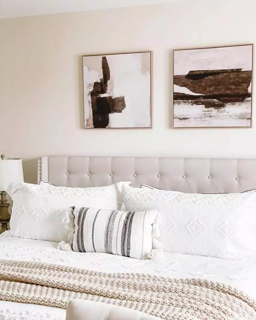 Two framed abstract earth tone paintings as modern over the bed wall decor